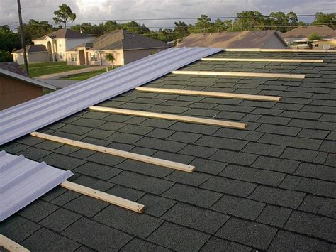 houses with shingles and metal roof|can you put metal roofing over shingles.